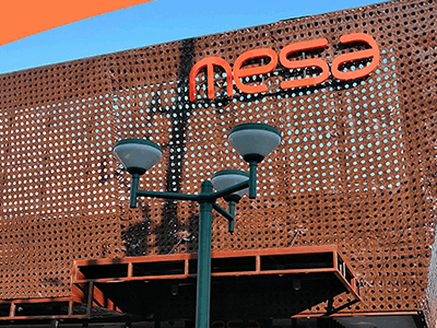 MESA sign on the perforated metal facade of a store